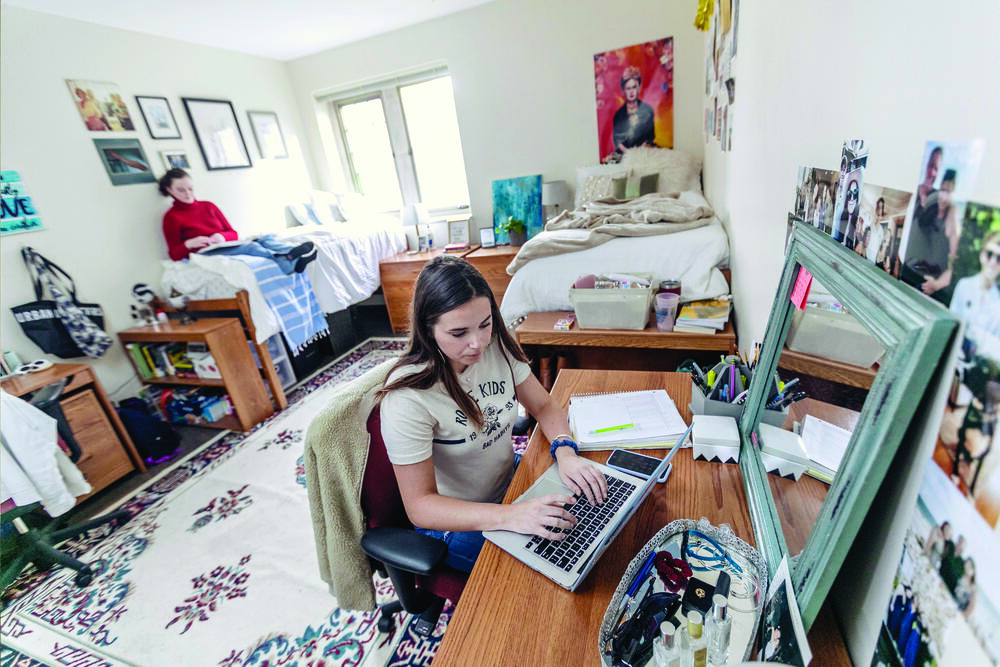 students study in a dorm room