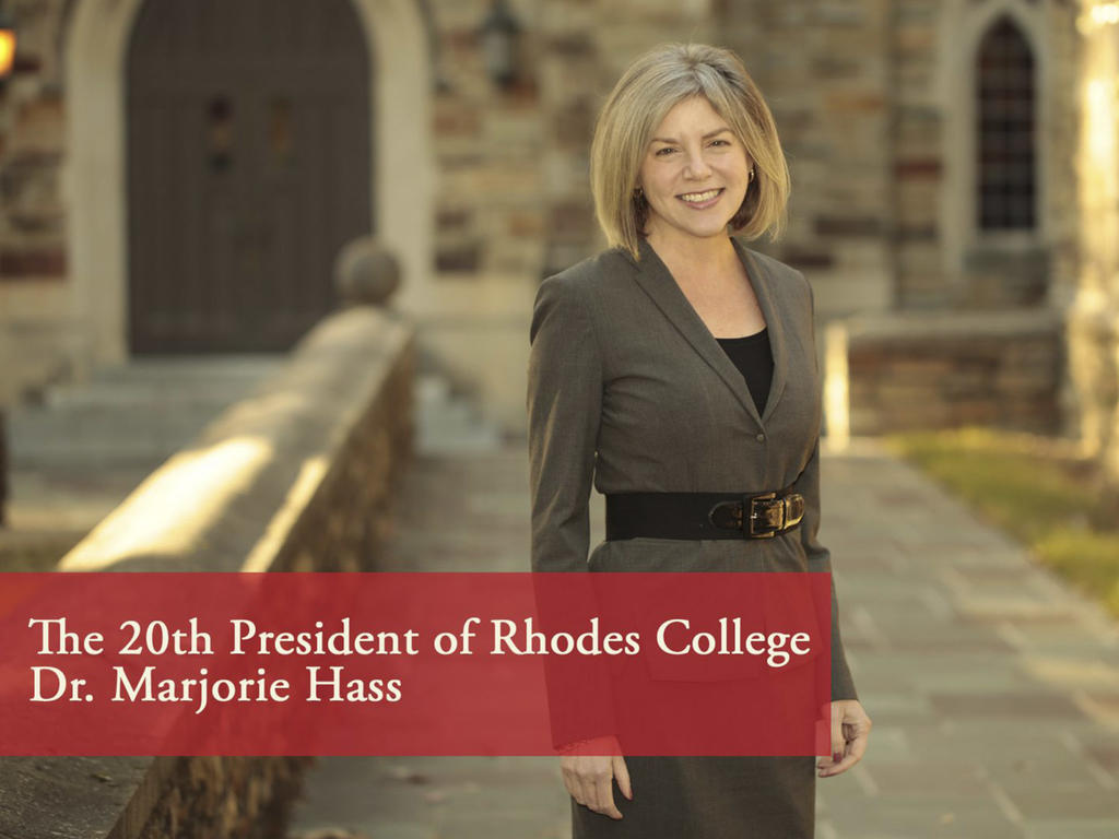 a woman standing in front of a gothic style building with the caption: "The 20th President of Rhodes College: Dr. Marjorie Hass"