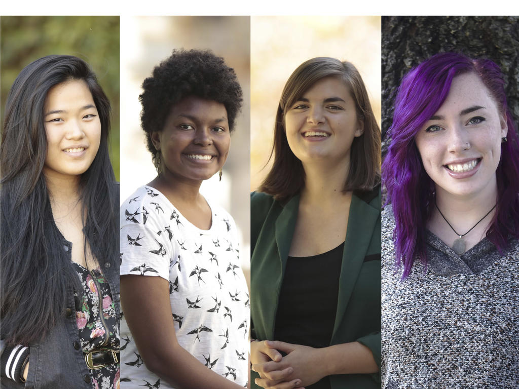 From left to right: a smiling Asian female collegiate student, an African American female student, a white, brunette female student, and a female student with purple hair. All are closeups and smiling