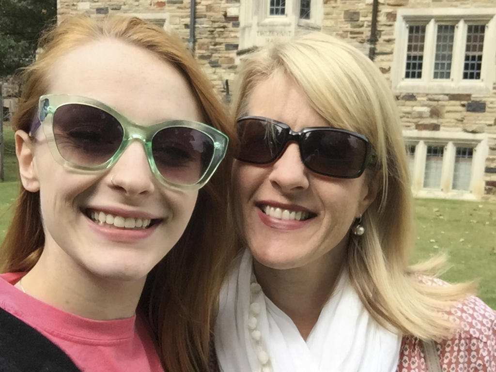 a selfie of two women wearing sunglasses