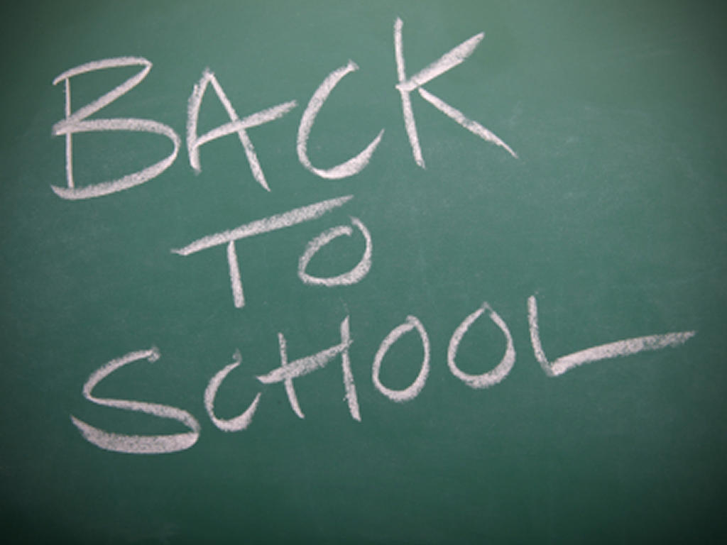 the text "back to school" written on a chalkboard