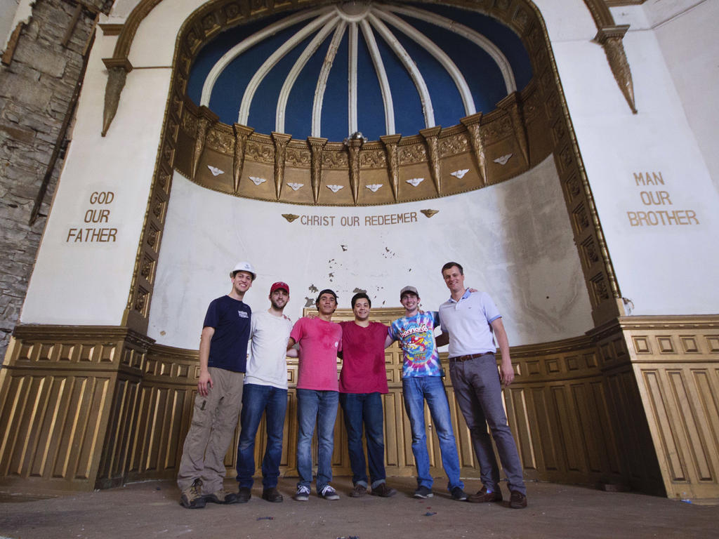 a group of students standing in a Jewish Temple