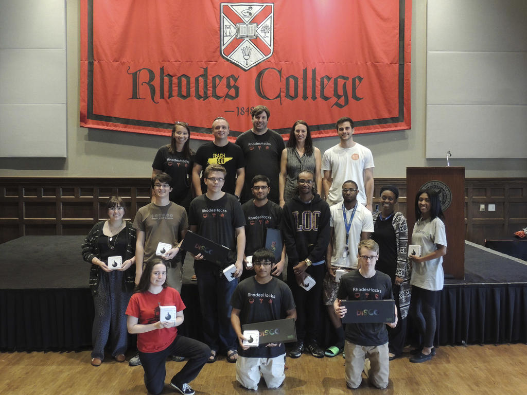a diverse group of students holding their technology prizes