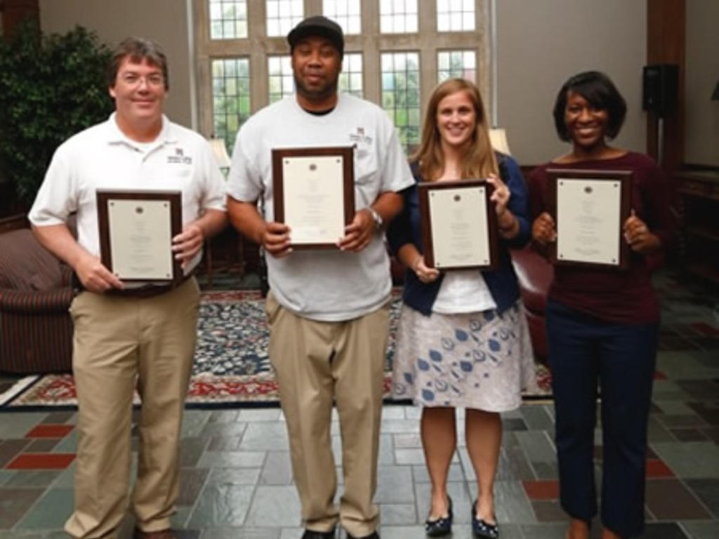Photo of Jeff McClain, Bobby Parson, Regina Simmons, and Kristen Hunt, recognized for Outstanding Staff.