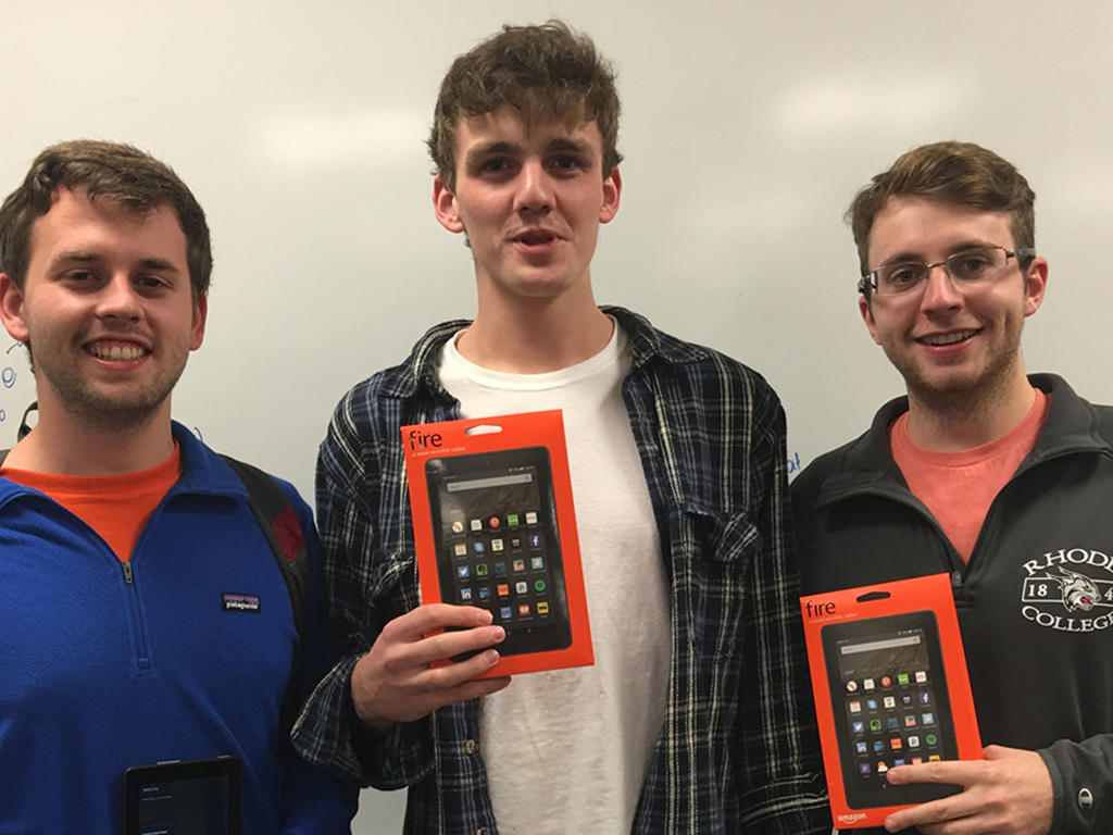 three male students holding their Amazon fires