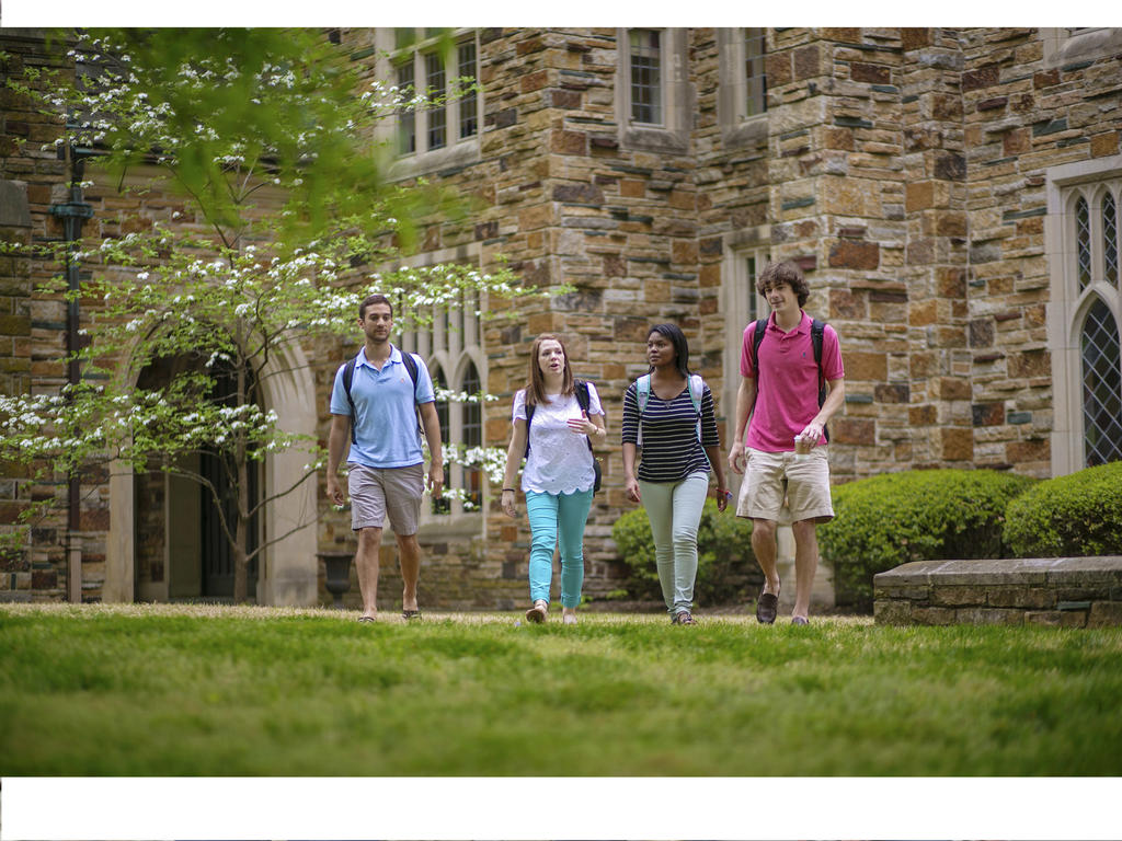 students socializing while walking to class