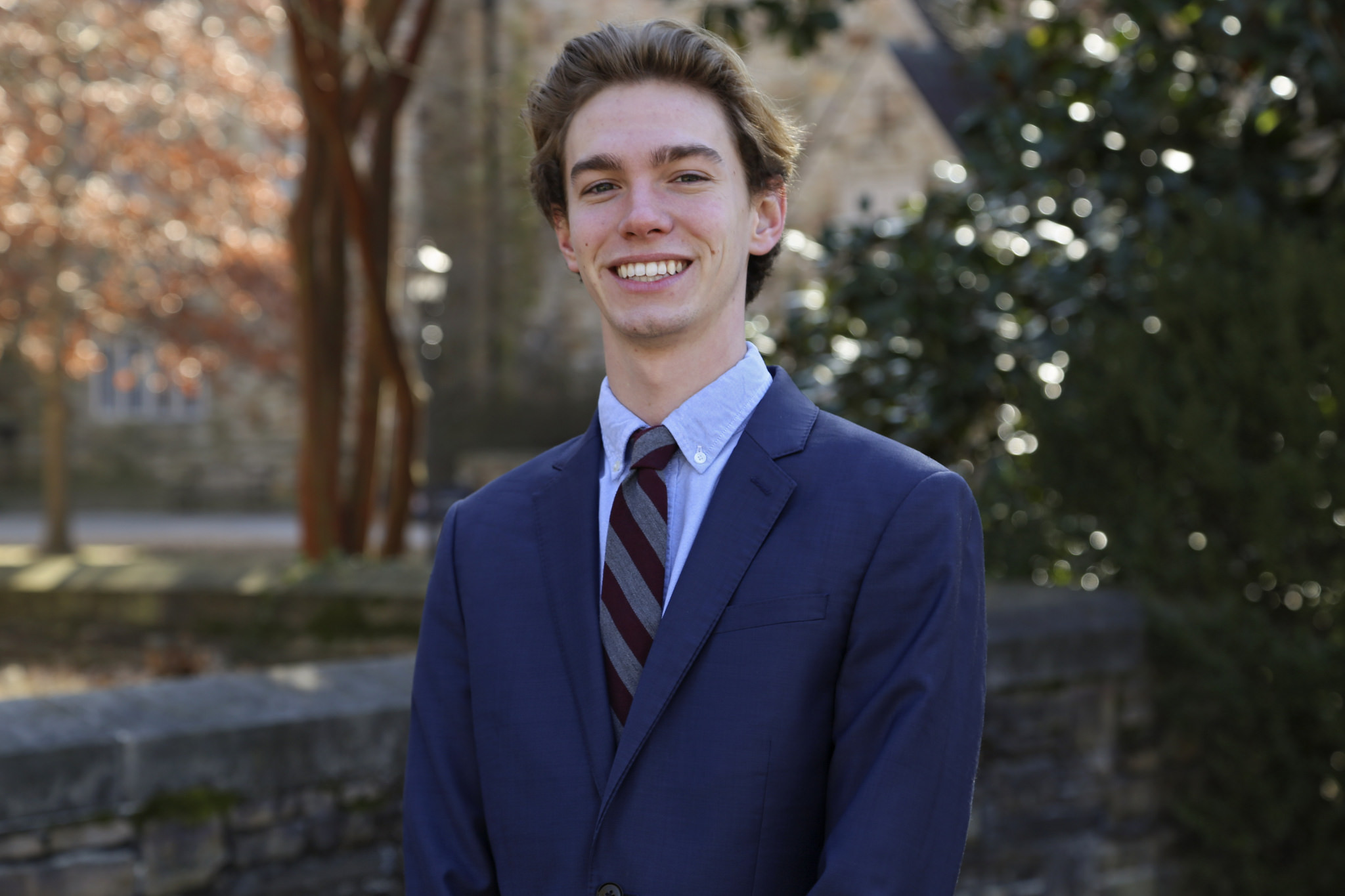Portrait of Zach Thornton outside by a tree