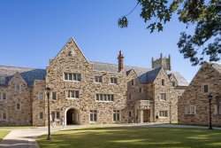 sandstone building with a slate roof
