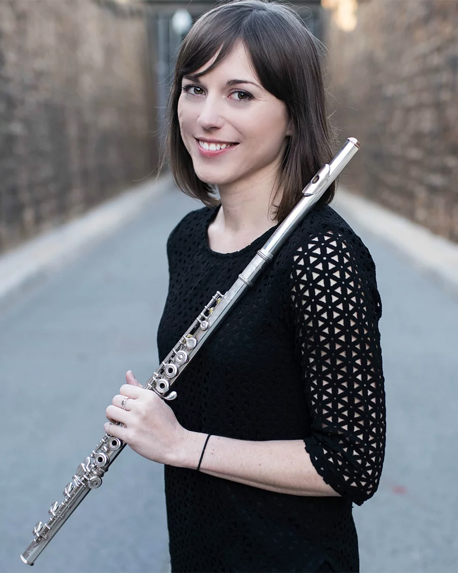 a young woman holding a flute 