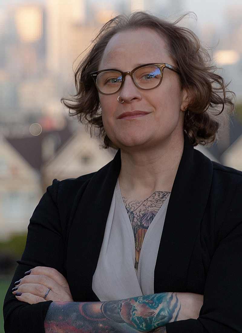 a female professor with arm tatoos
