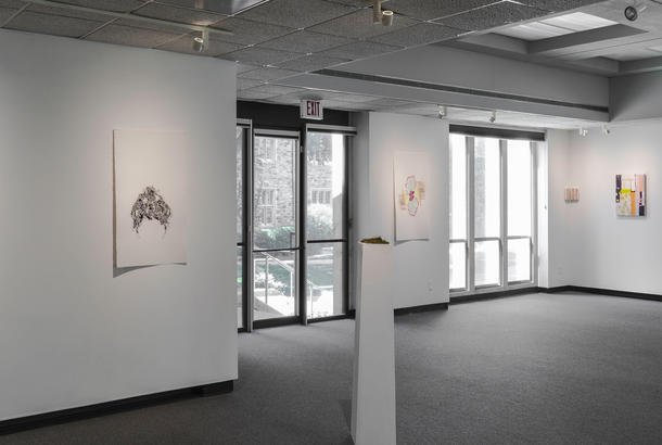 The interior of a white walled gallery.