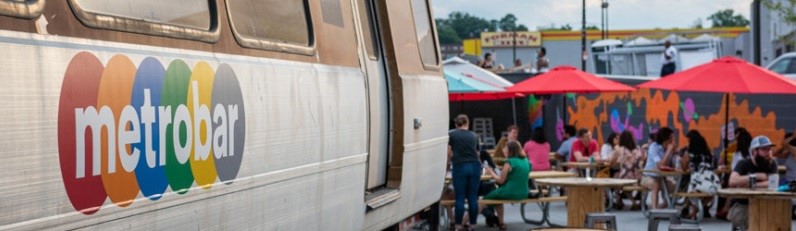 a photo of the Metrobar van and picnic tables