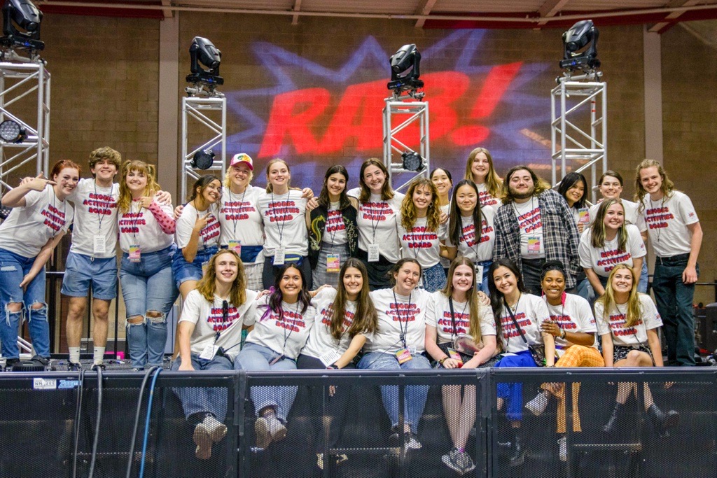 a large groups of students wearing Rhodes Activities Board tee shirts