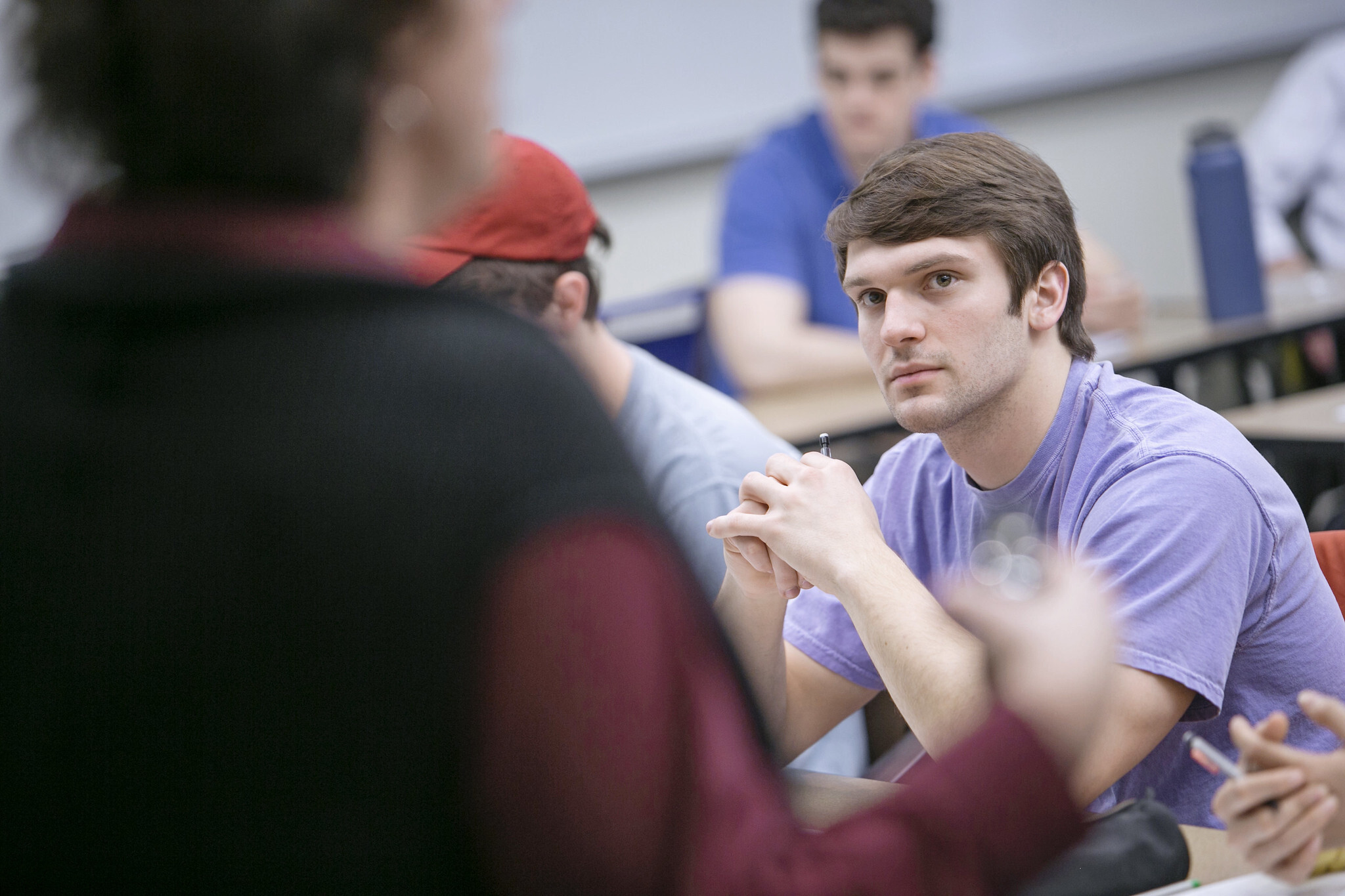 A student pays attention in class.