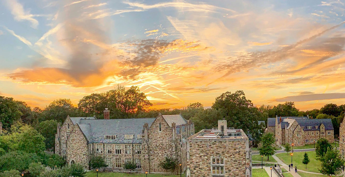 a sunset over Gothic buildings