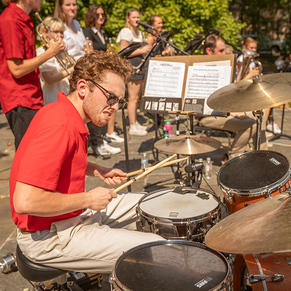 a young man drums onstage