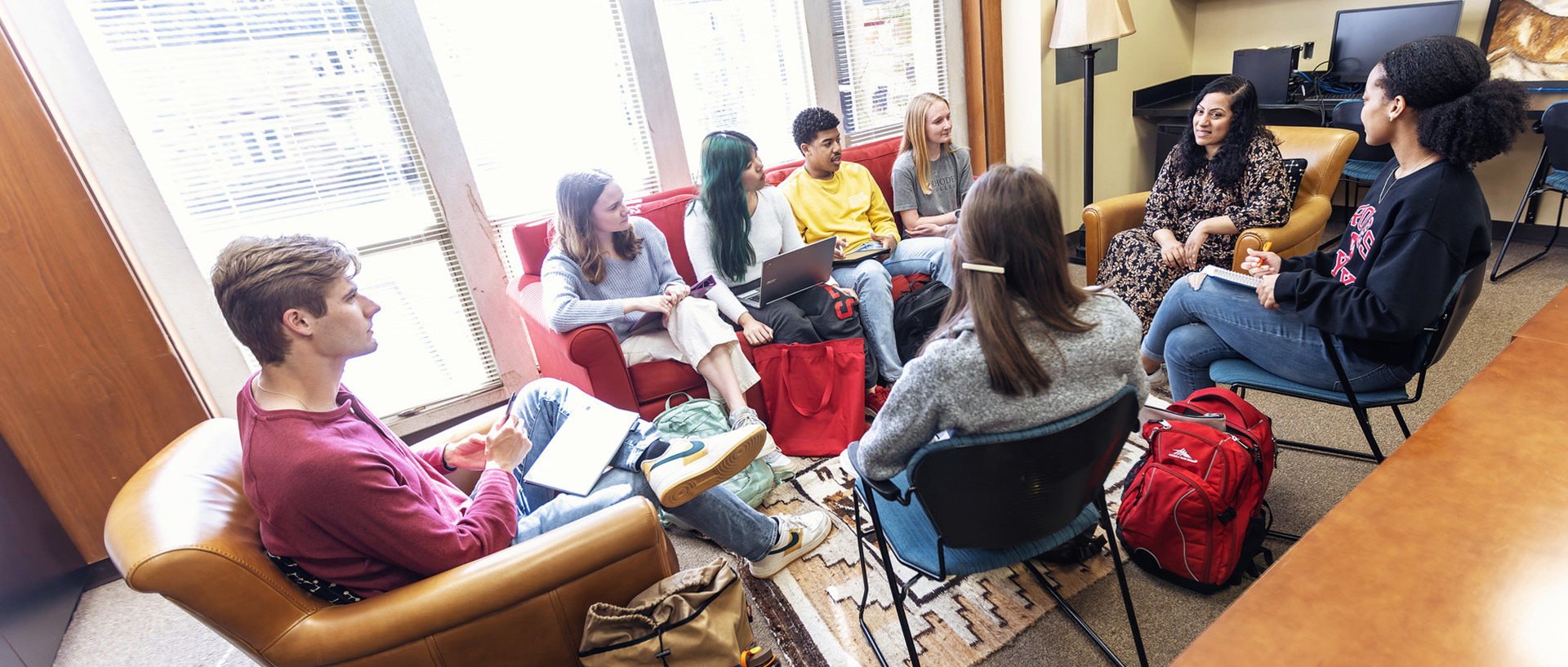 students meet with a professor