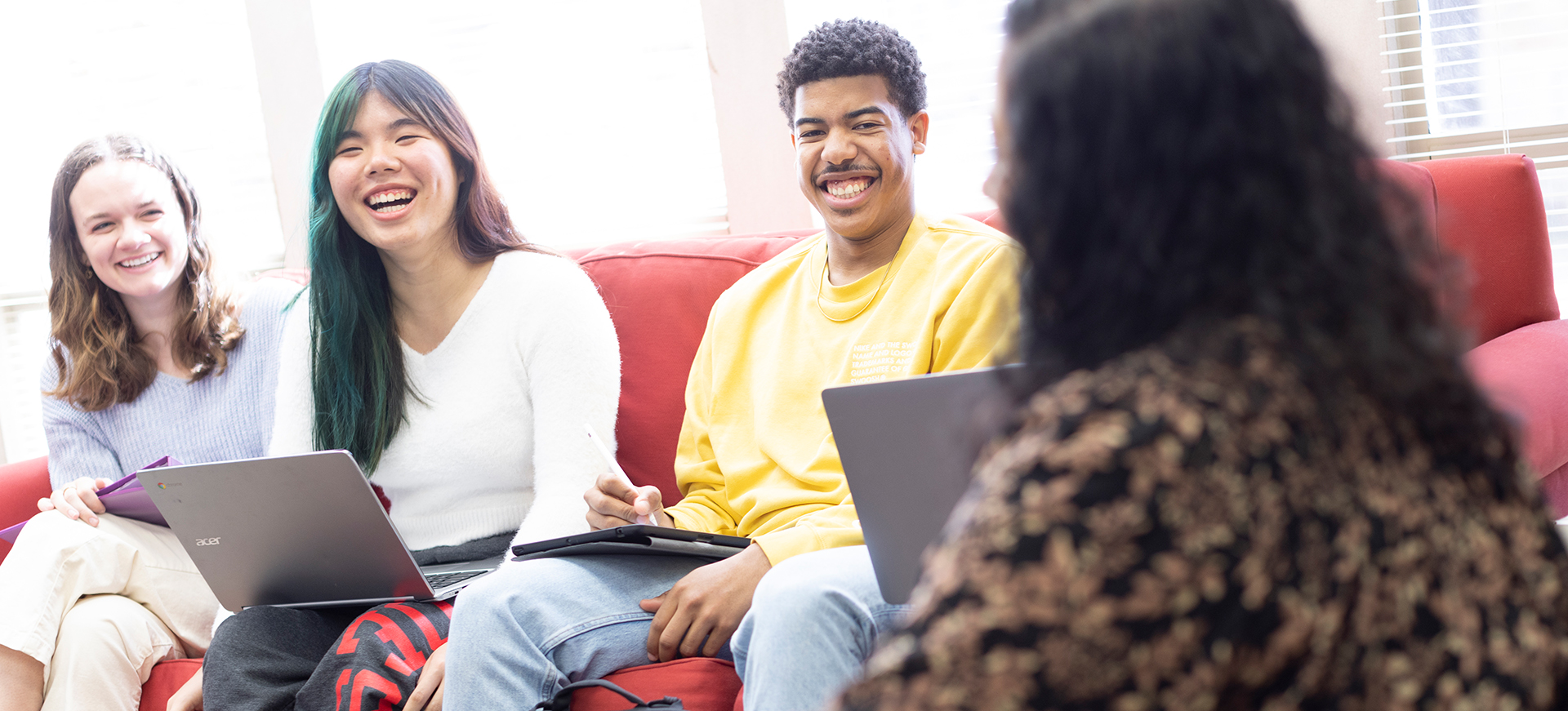 students smile at a professor