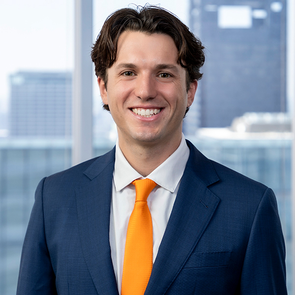 a young man in a suit and tie