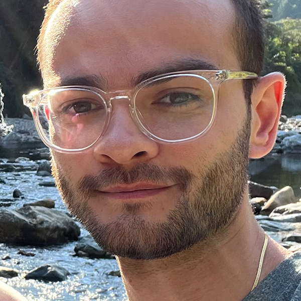 a young man in glasses