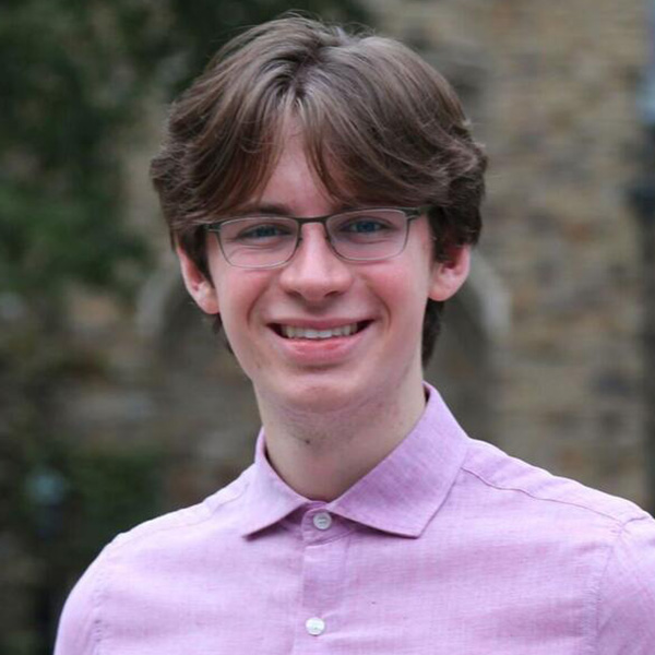 Hugh Ferguson, a young man with brown hair and glasses