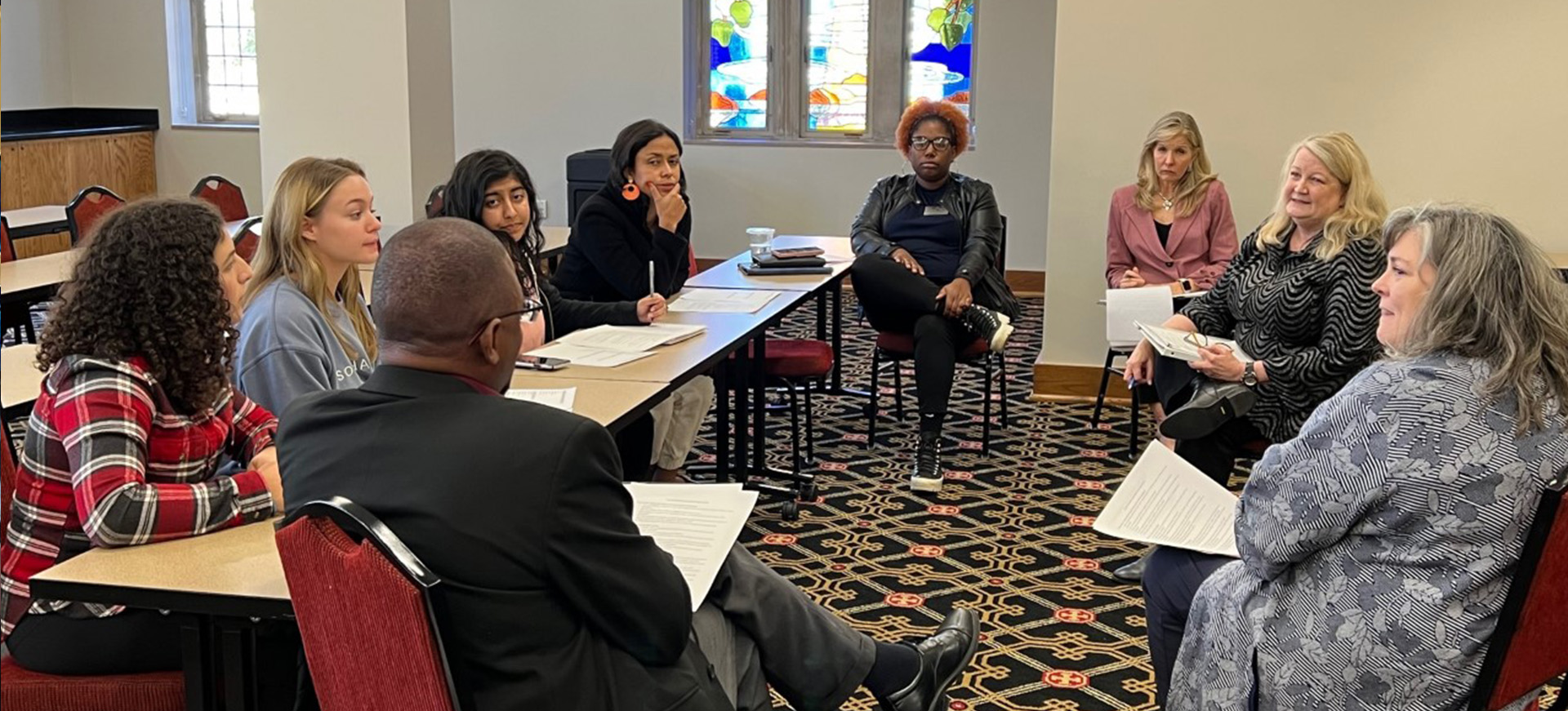President Collins meets with a group to discuss safety issues.