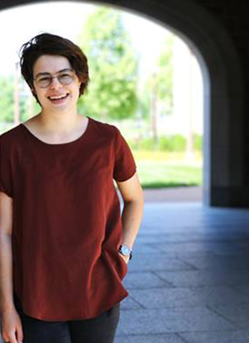  a young person smiles at the camera