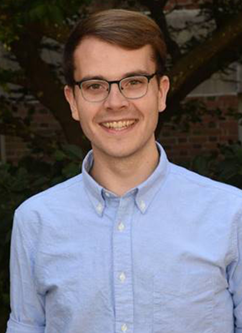 a young man in glasses