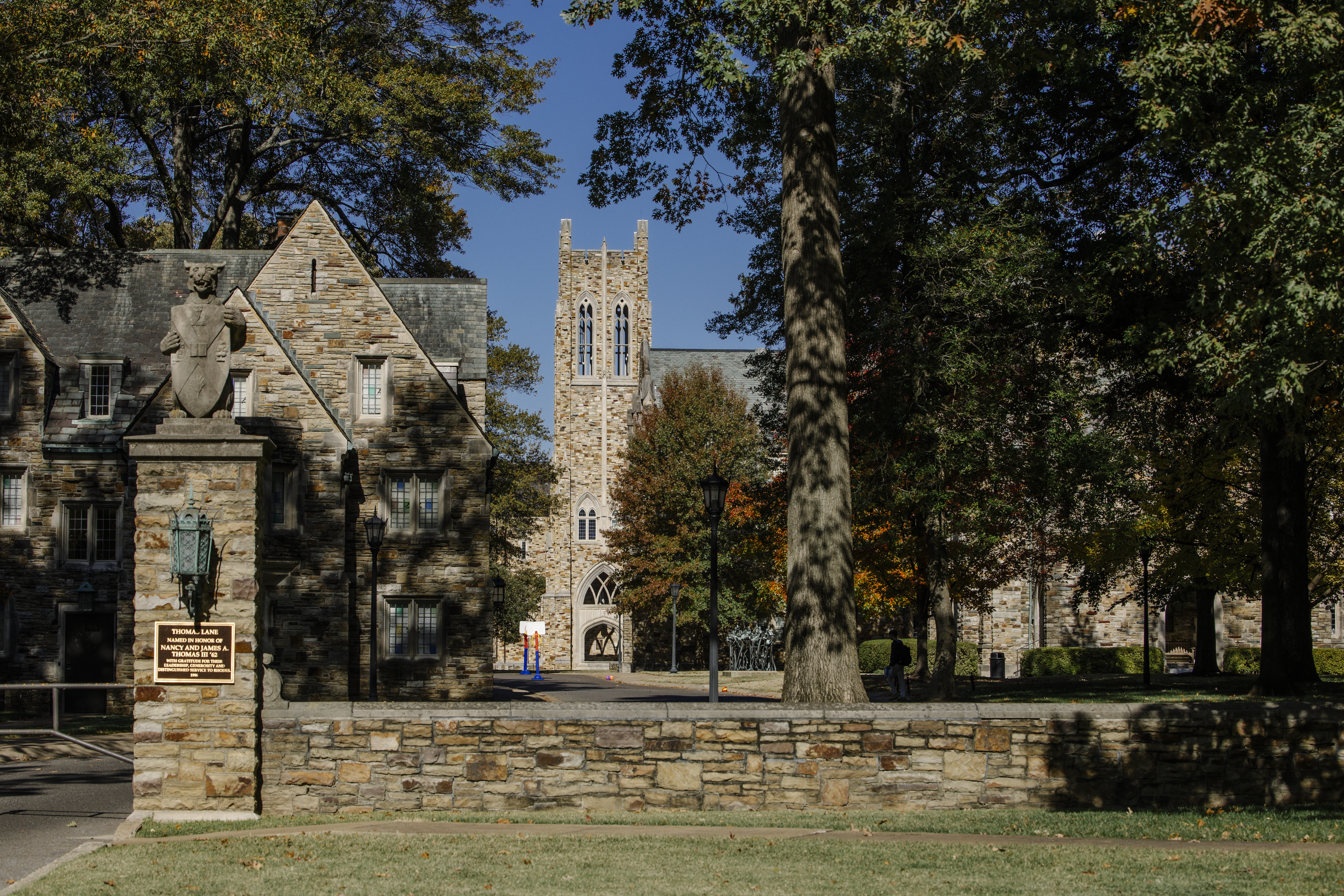 a Gothic stone gate with a statue of a Lynx