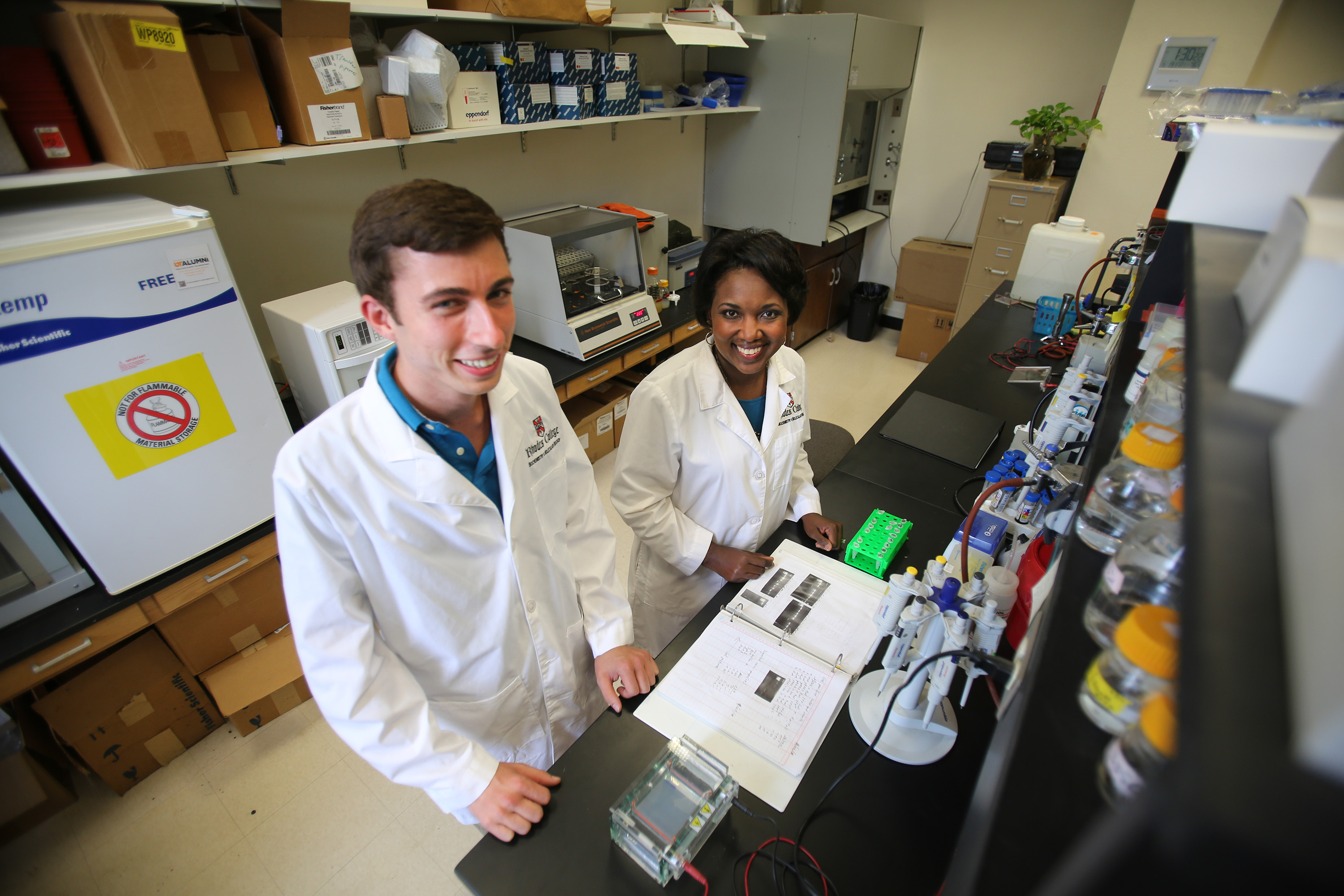 a student and professor in a lab