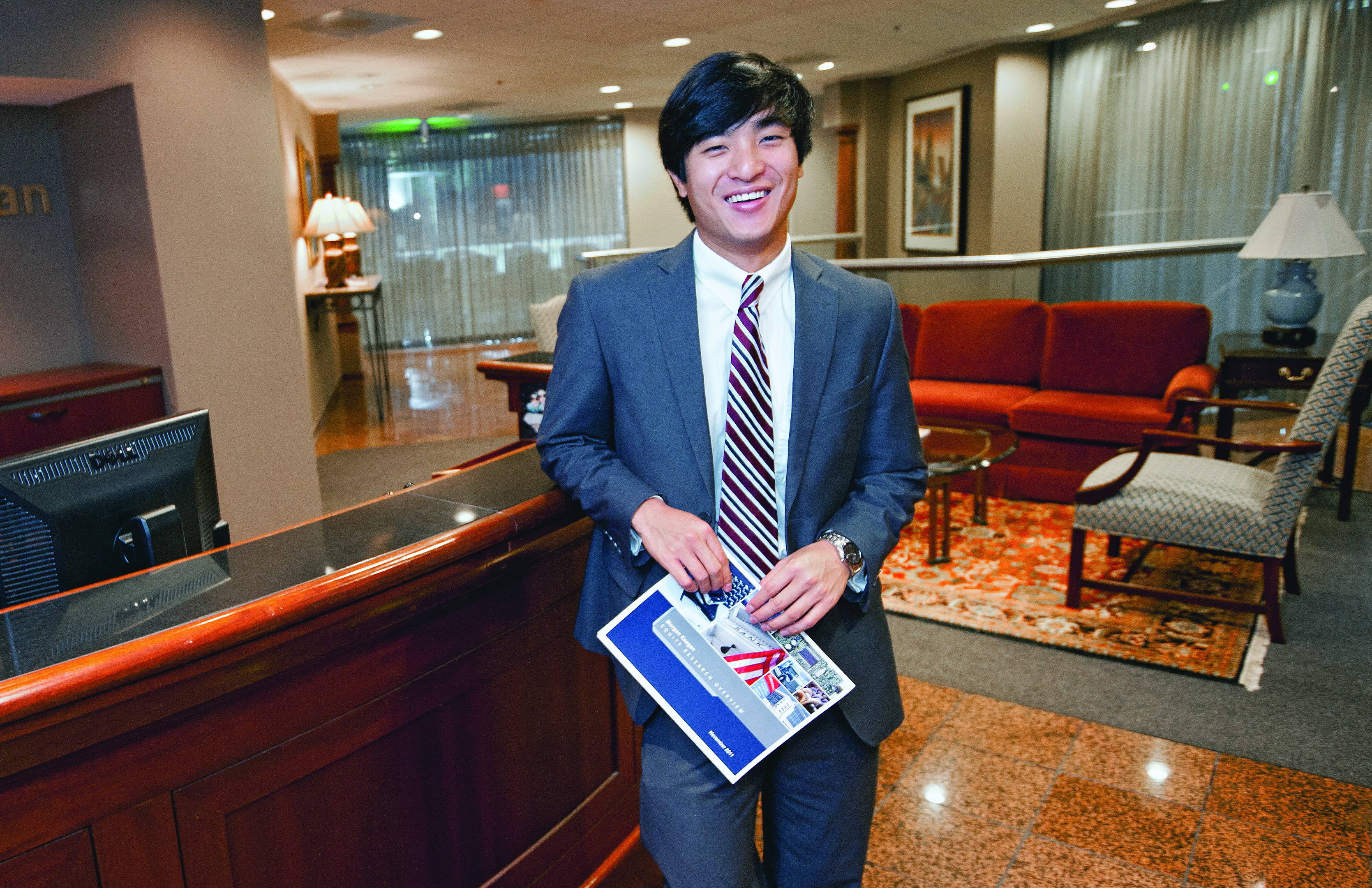 Student wearing a suit in a professional office