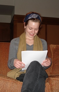 a female student holds an invitation at the induction ceremony