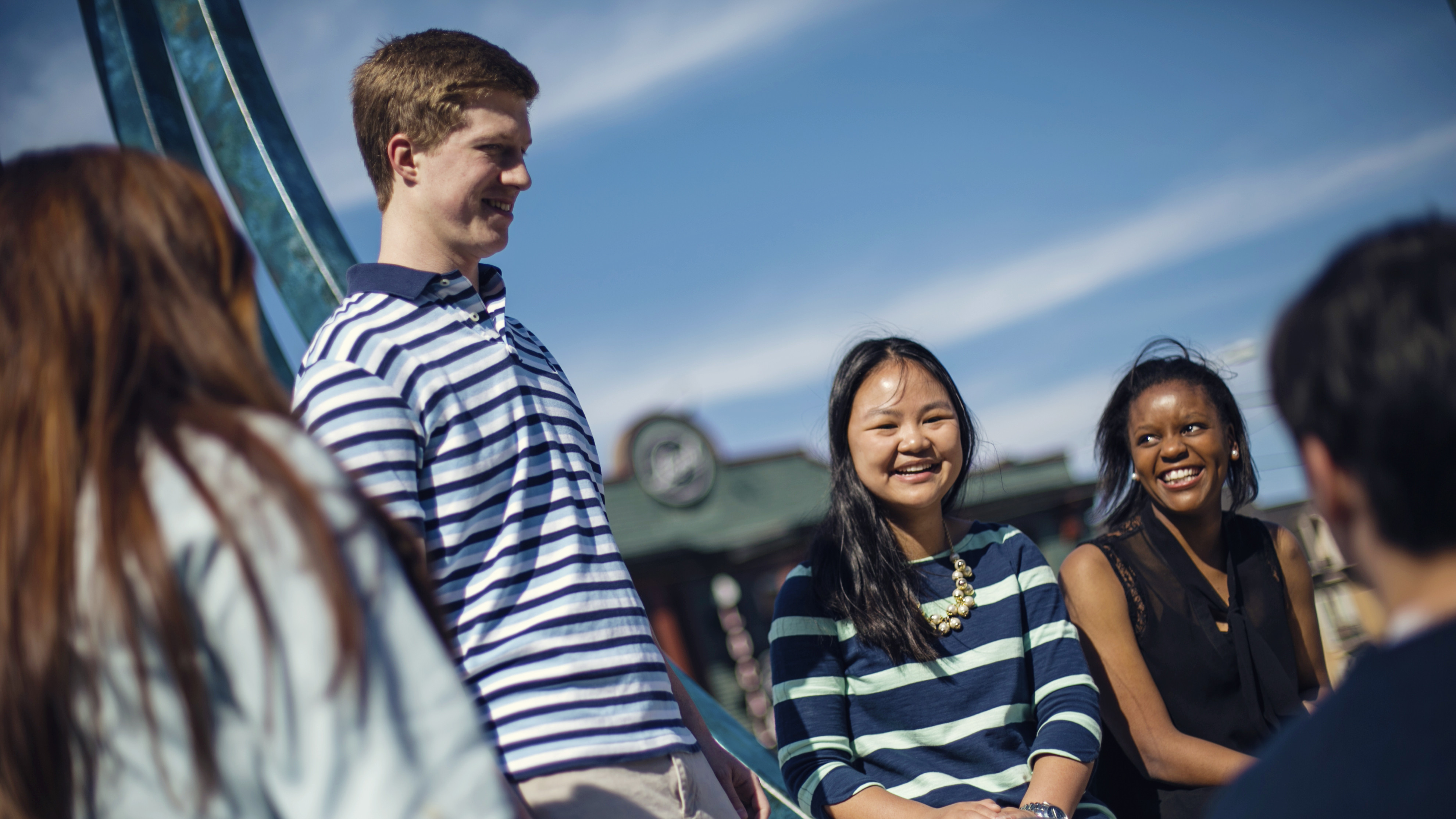 a group of students outside on a sunny day