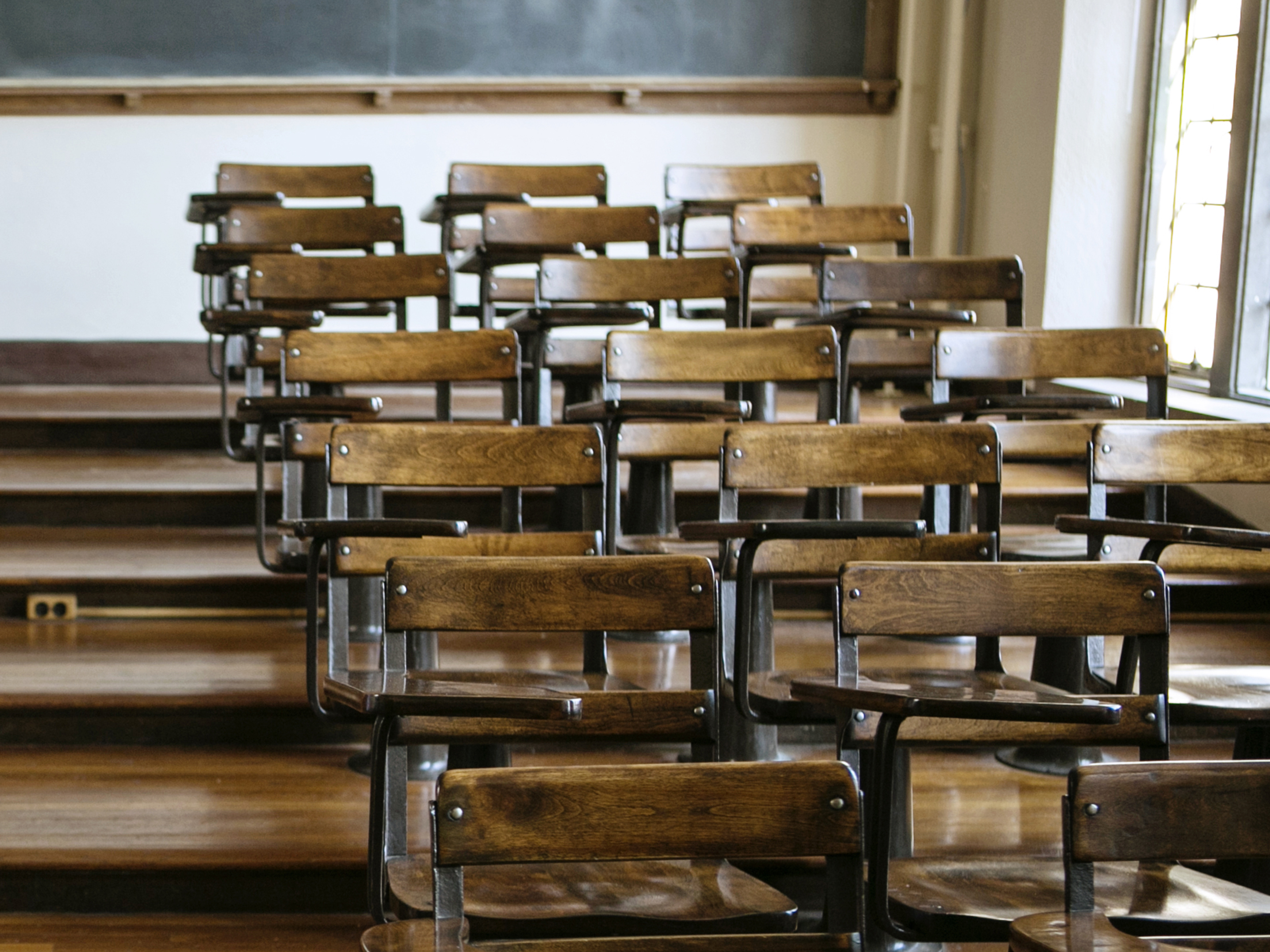 Empty lecture hall chairs