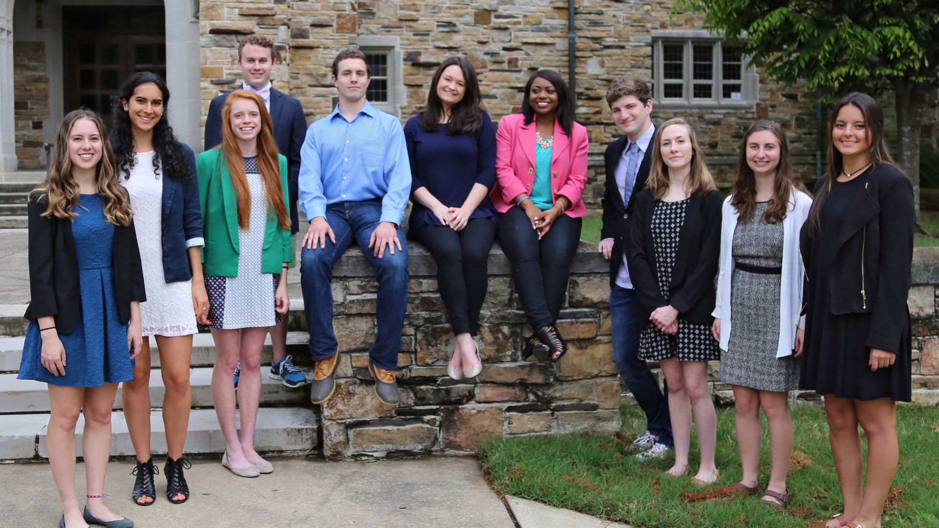 a group of students standing outside buckman hall