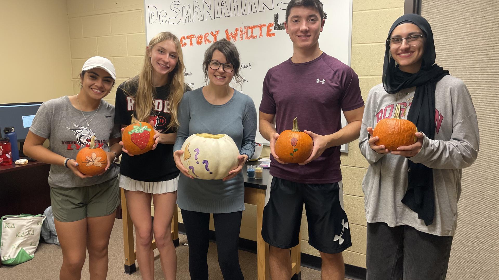 students with pumpkins