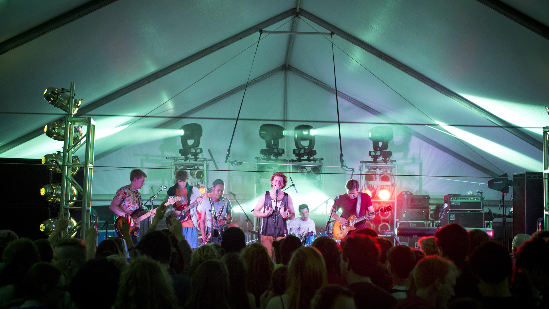 a band performs under a tent 