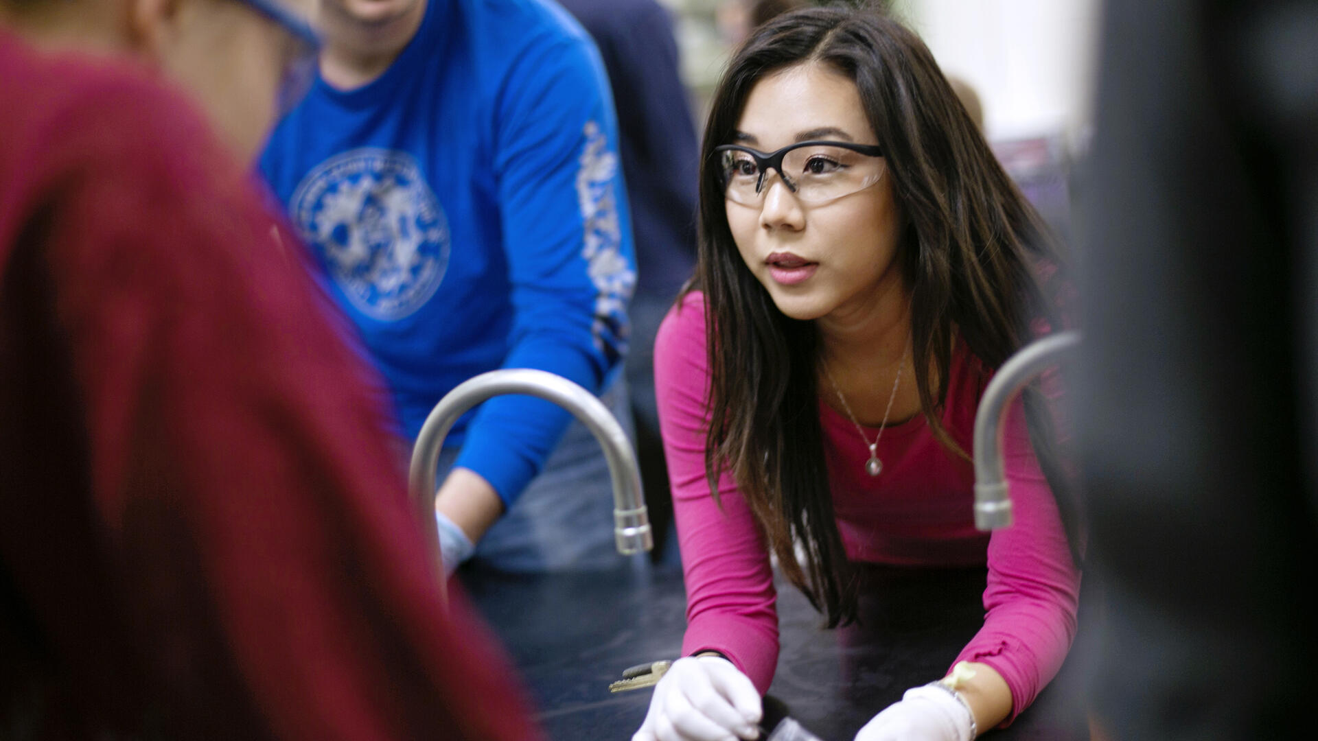 Student wearing protective glasses at laboratory