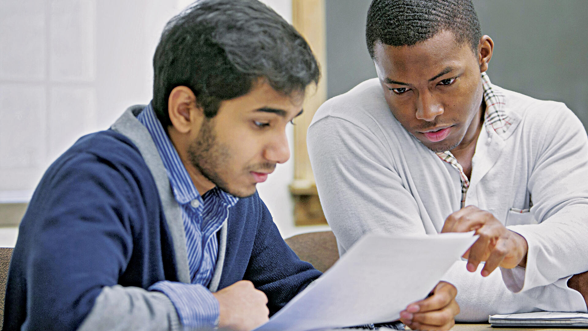 2 male students studying