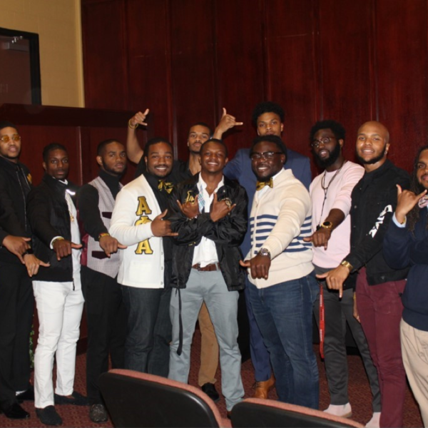 Several men, some wearing Alpha Phi Alpha letters