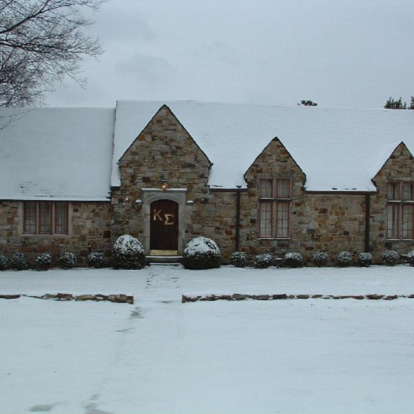 A stone house in the snow