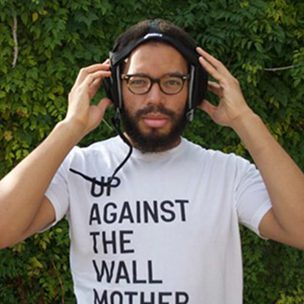 an African American male with headphones on