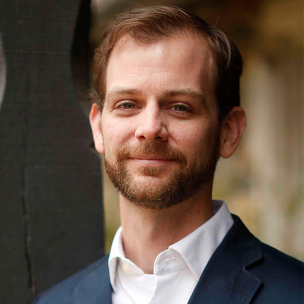 head shot of a man with a beard