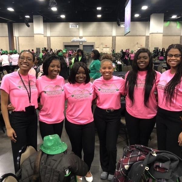 six young women in pink t-shirts