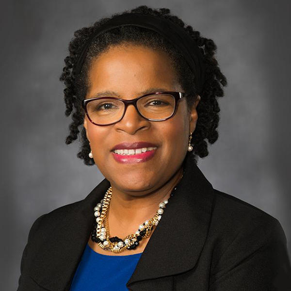 Katherine Bassard an african american woman with glasses