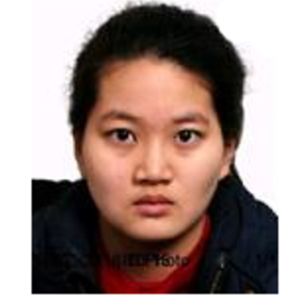 an Asian female looks at the camera