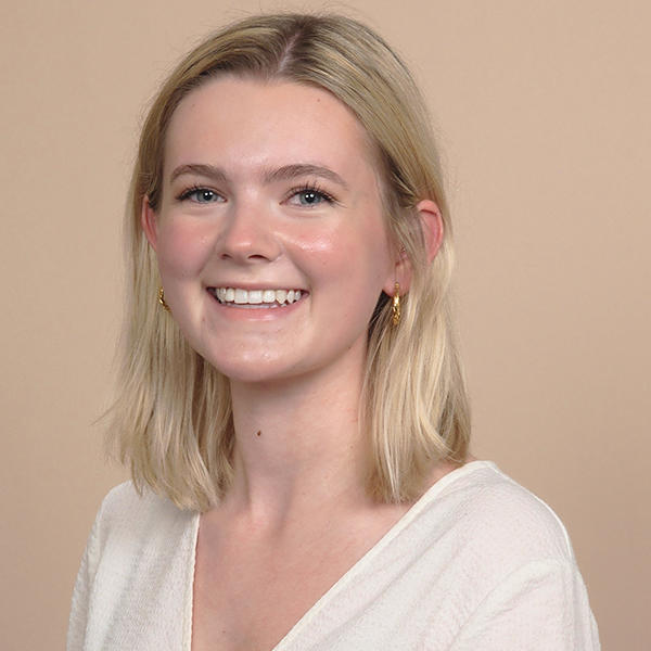 a young woman with should-length blonde hair