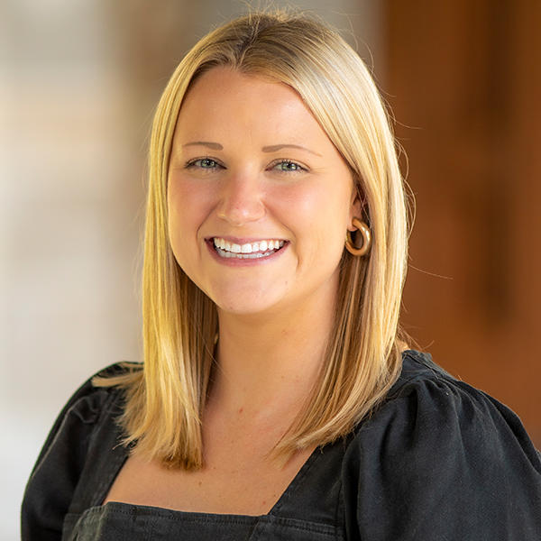 a young woman with shoulder-length blonde hair