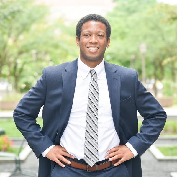 a young African American man in a suit and tie