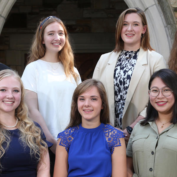 five female students smile at the camera